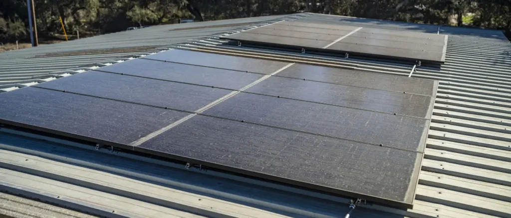 Solar panels on a metal commercial roof, roof replacement with solar panels