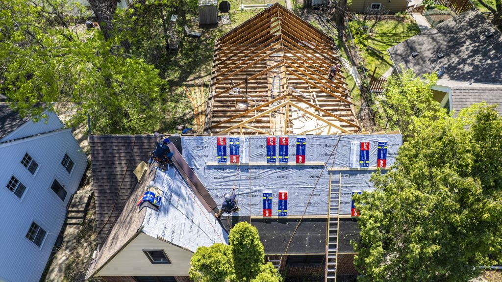 A roof replacement in progress in reference to the question "When should you replace a roof?"