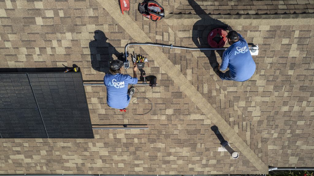A solar panel installation shown in reference to a homeowner asking "How much does it cost to install solar panels?"